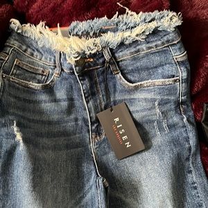 Wide leg slightly cropped raw hem jeans by Risen. Size 5.